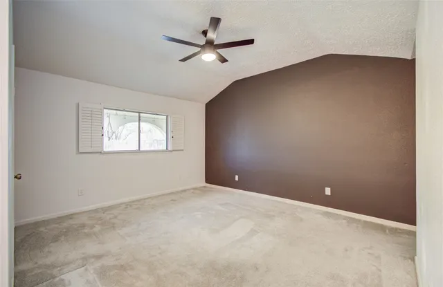 a bathroom with a toilet and a bathtub