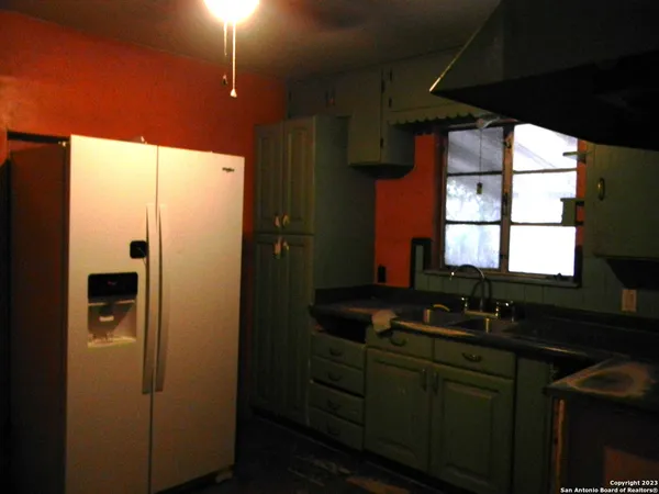 a bathroom with a sink a mirror and window