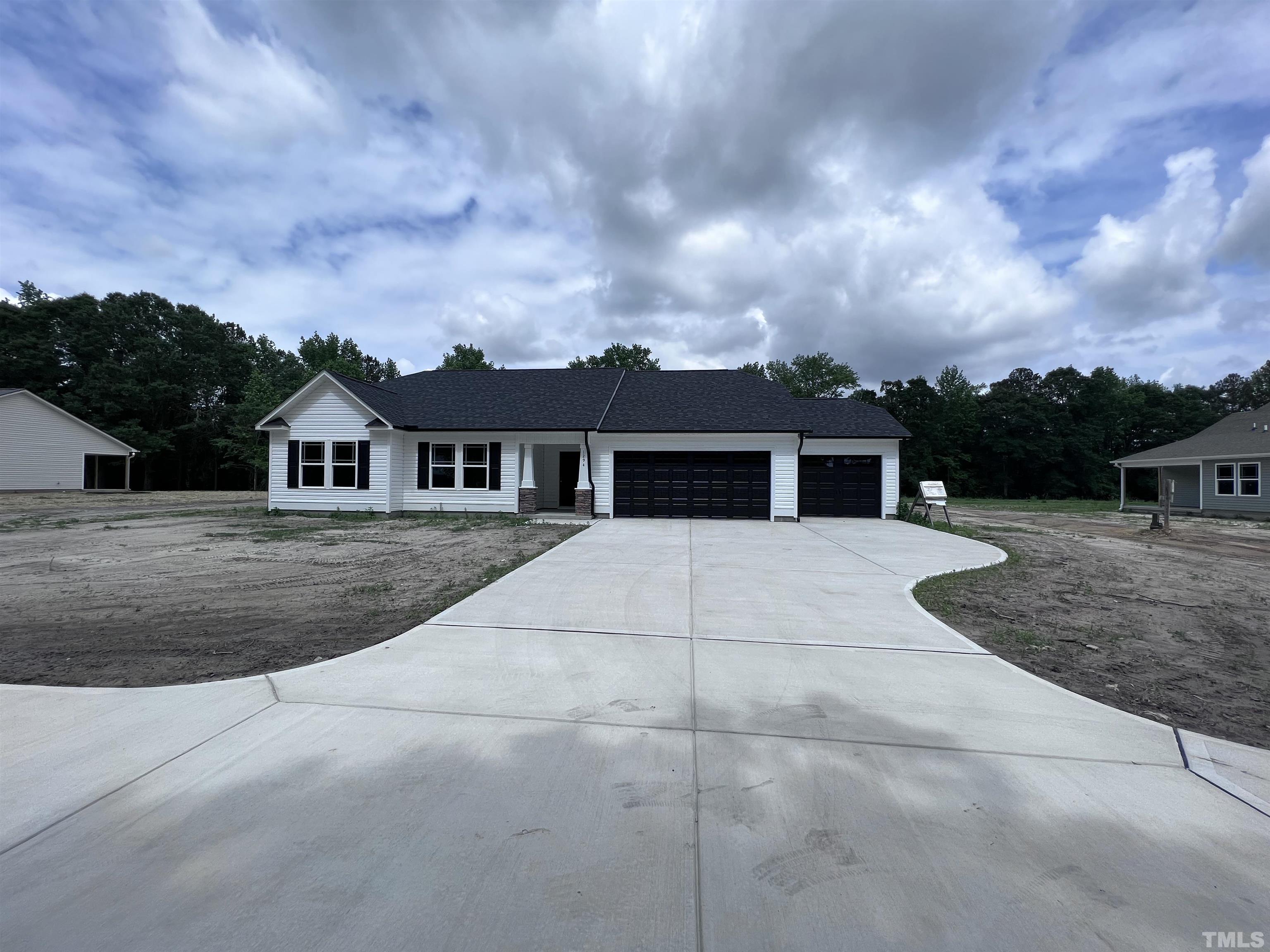 1294 Lee Road Clayton, NC 27520 - Photo 1 of 15 front view of house with a yard