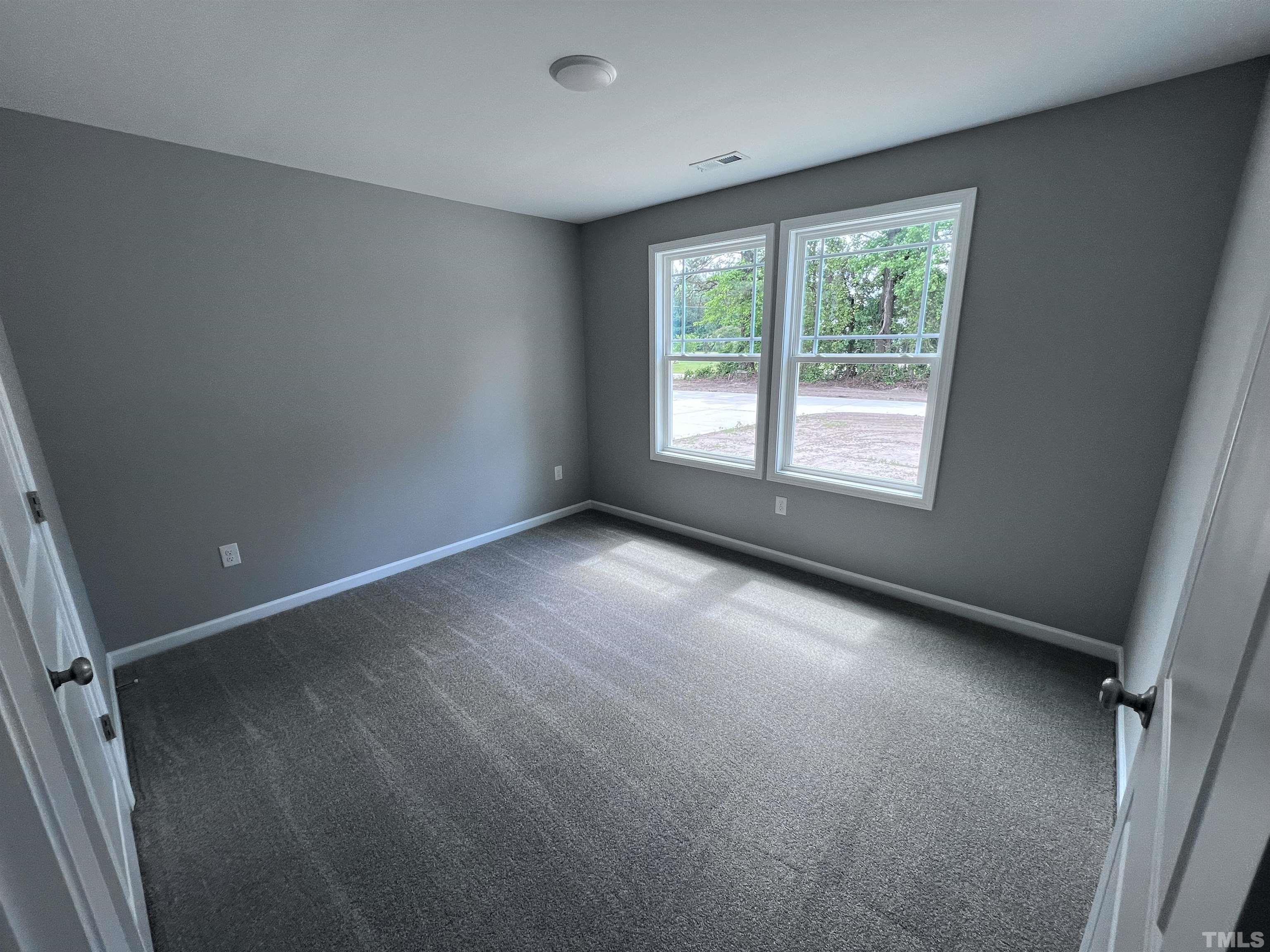 1294 Lee Road Clayton, NC 27520 - Photo 11 of 15 an empty room with a window