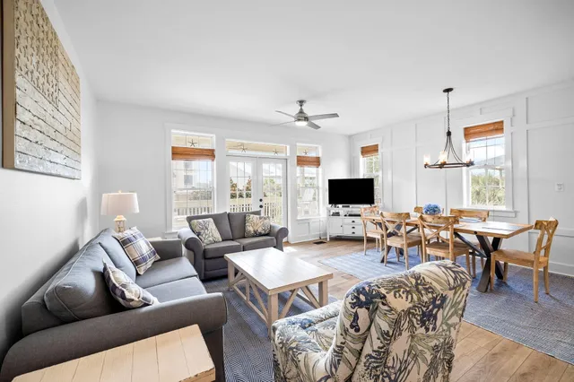 a living room with furniture fireplace and window
