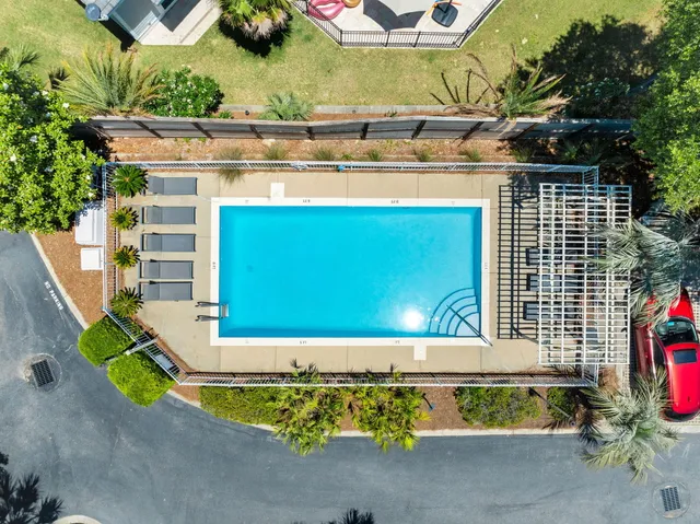 a view of a swimming pool with a lounge chairs