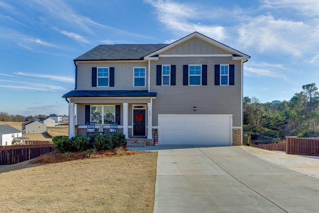 236 Ralph Still Road Dacula, GA 30019 - Photo 1 of 68 a front view of a house with garden
