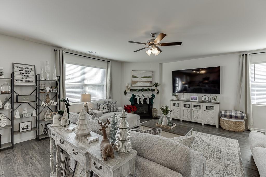 236 Ralph Still Road Dacula, GA 30019 - Photo 15 of 68 a living room with furniture and a flat screen tv
