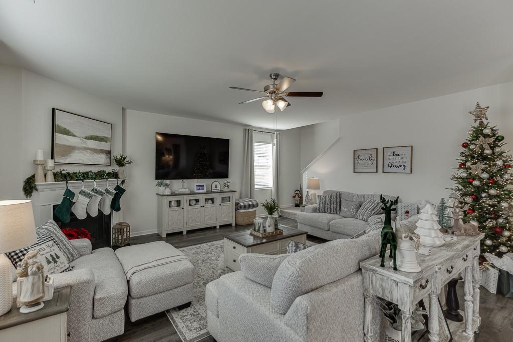 236 Ralph Still Road Dacula, GA 30019 - Photo 16 of 68 a living room with furniture and a flat screen tv