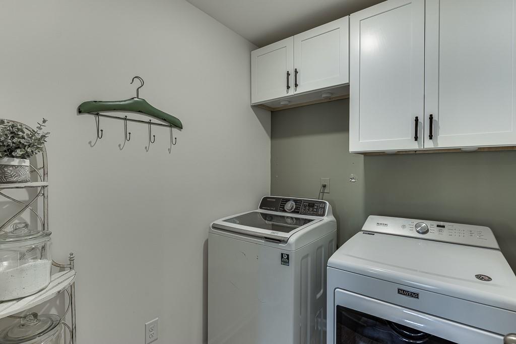 236 Ralph Still Road Dacula, GA 30019 - Photo 22 of 68 a utility room with dryer and washer