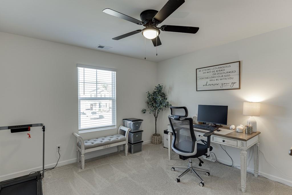 236 Ralph Still Road Dacula, GA 30019 - Photo 25 of 68 a view of a workspace with furniture and a window