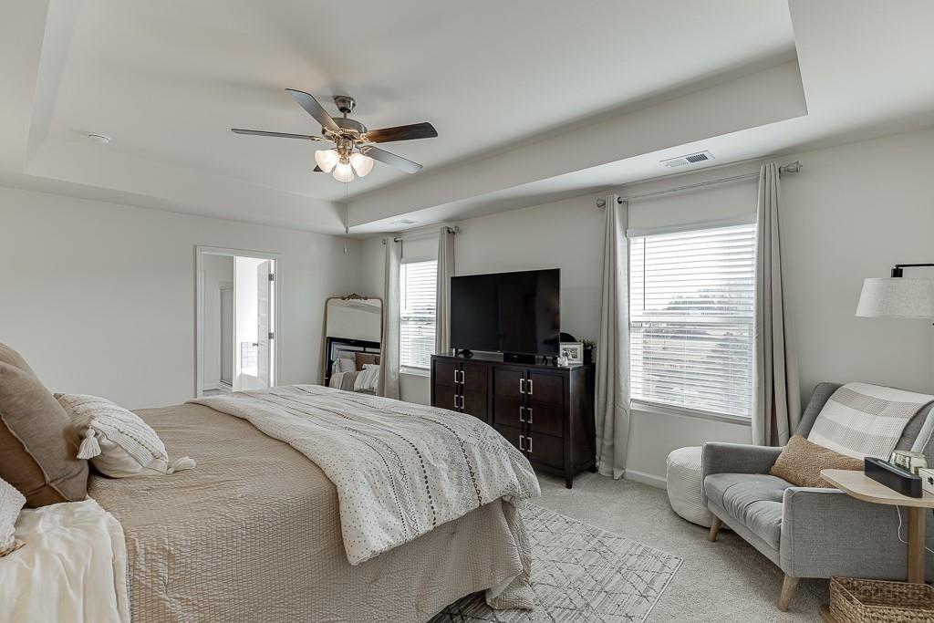 236 Ralph Still Road Dacula, GA 30019 - Photo 32 of 68 a bedroom with a bed and a couch