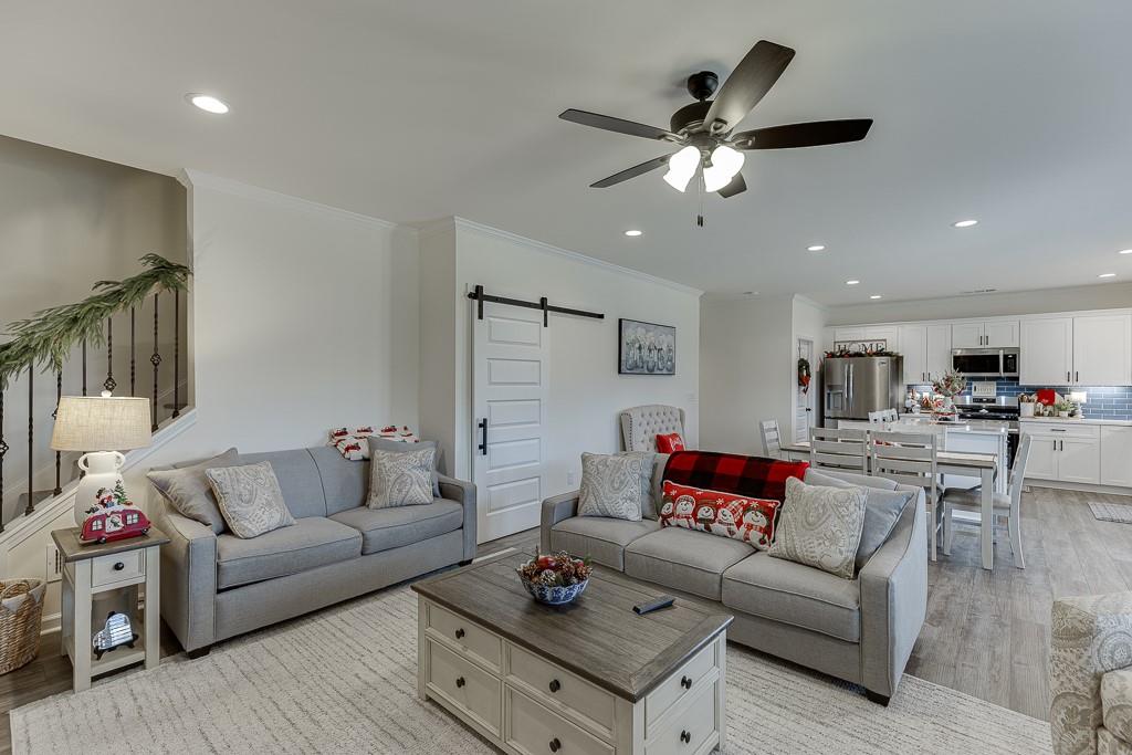 236 Ralph Still Road Dacula, GA 30019 - Photo 40 of 68 a living room with furniture and kitchen view