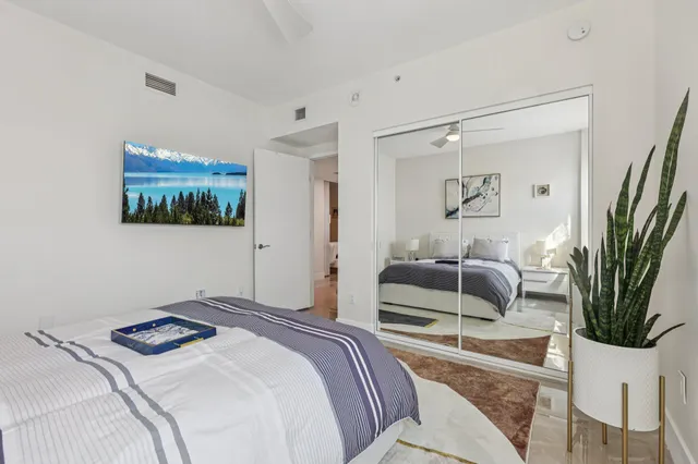 a living room with a bed furniture and a window