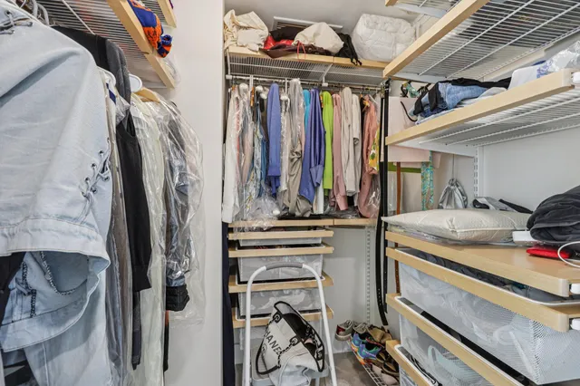 a bathroom with a granite countertop shower and a toilet
