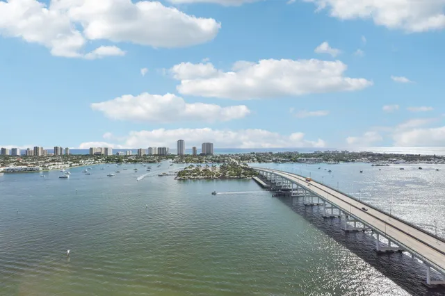 a view of a swimming pool with outdoor seating and a patio