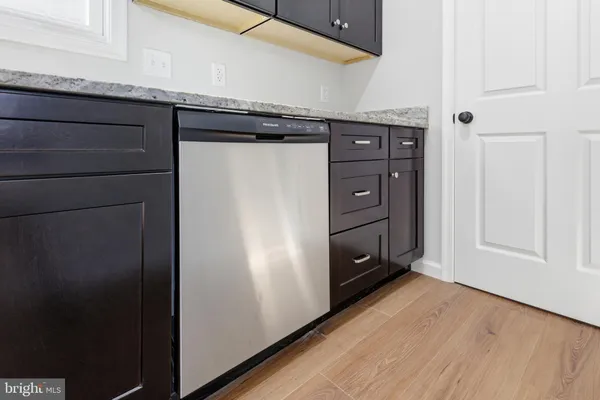 an empty room with a window and a ceiling fan