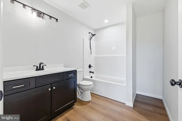 a bathroom with a sink and a window