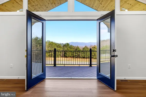 a kitchen with stainless steel appliances granite countertop a sink and a refrigerator