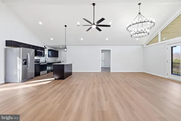 a view of a room with a window and a chandelier