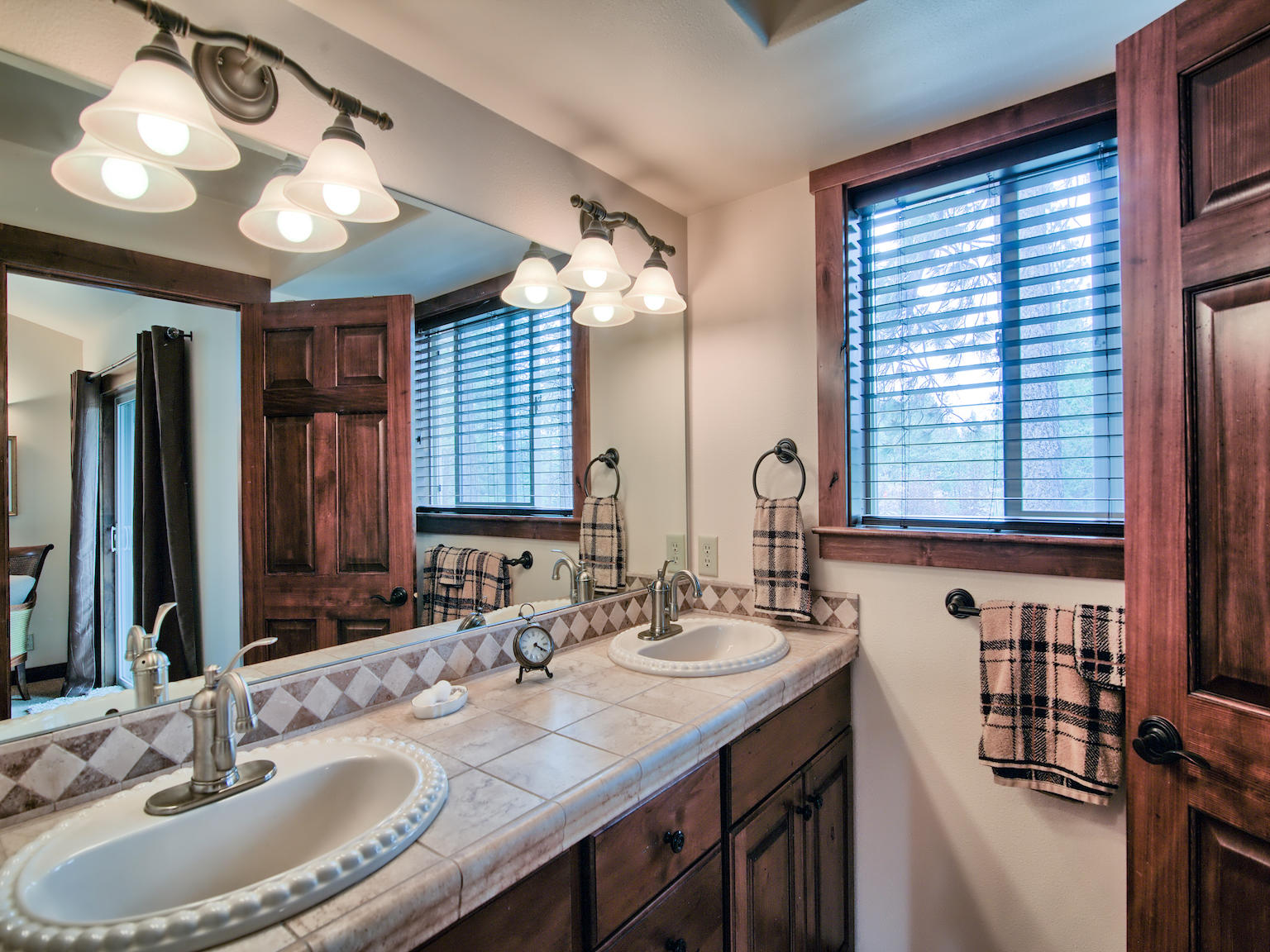 69767 Pine Ridge Road Sisters, OR 97759 - Photo 21 of 31 Master Suite bathroom with dual sinks and cusom cabinets.