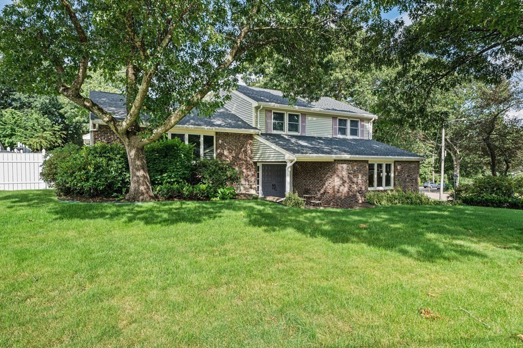 19 Ledge Hill Street Randolph, MA 02368 - Photo 1 of 37 a front view of a house with a yard and trees