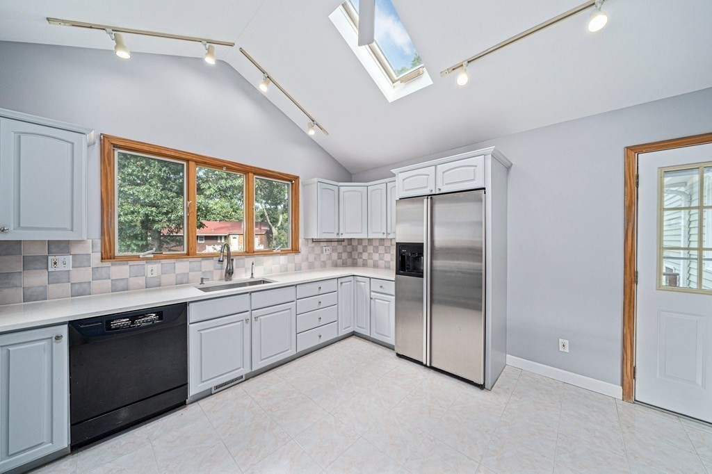 19 Ledge Hill Street Randolph, MA 02368 - Photo 12 of 37 a kitchen with a sink stainless steel appliances and window