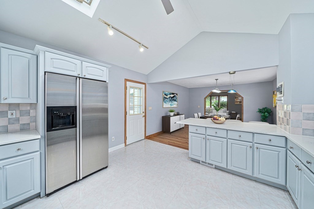 19 Ledge Hill Street Randolph, MA 02368 - Photo 13 of 37 a kitchen with white cabinets and refrigerator