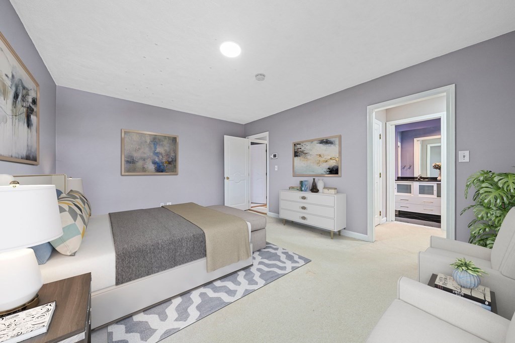 19 Ledge Hill Street Randolph, MA 02368 - Photo 19 of 37 a spacious bedroom with a large bed and a couch