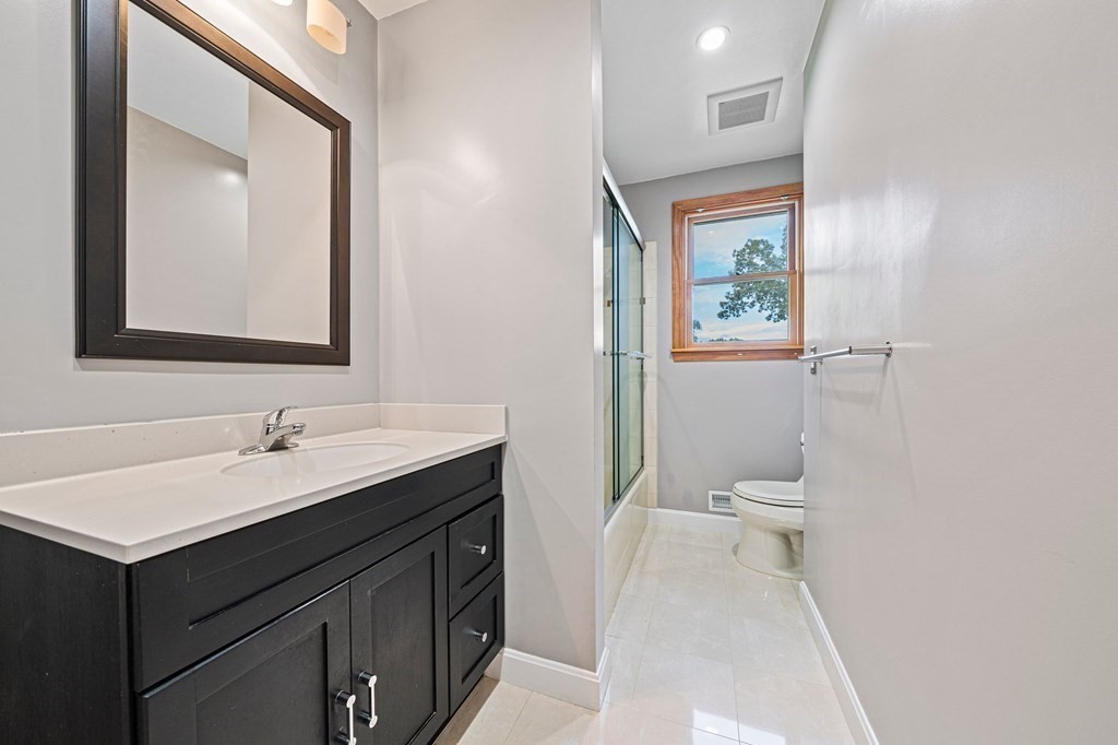 19 Ledge Hill Street Randolph, MA 02368 - Photo 23 of 37 a bathroom with a sink and a toilet