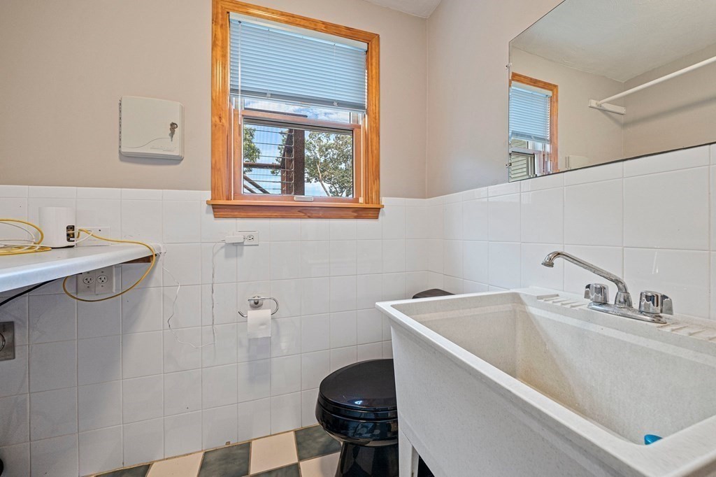 19 Ledge Hill Street Randolph, MA 02368 - Photo 24 of 37 a bathroom with a sink and a toilet