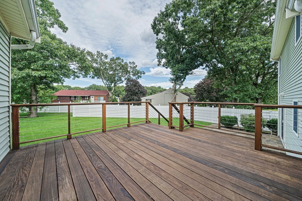 19 Ledge Hill Street Randolph, MA 02368 - Photo 26 of 37 a view of house with deck and a garden