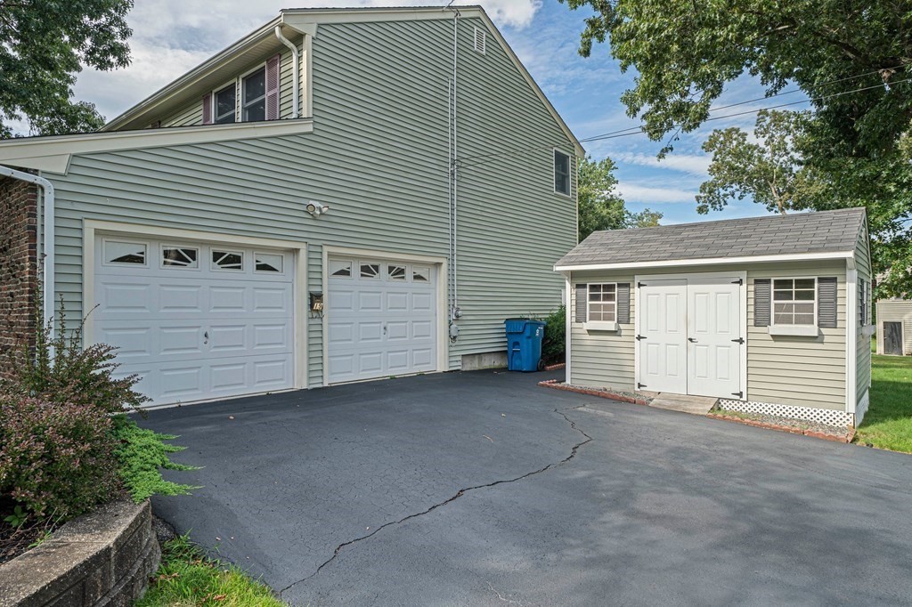 19 Ledge Hill Street Randolph, MA 02368 - Photo 3 of 37 a view of a house with a garage