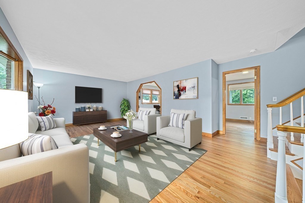 19 Ledge Hill Street Randolph, MA 02368 - Photo 6 of 37 a living room with furniture and a flat screen tv
