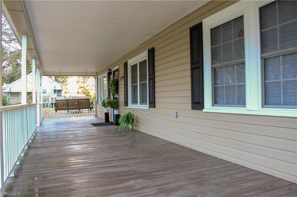 1159 Naomi Road Randleman, NC 27317 - Photo 3 of 23 Huge 10' x 46' Rocking Chair Front Porch