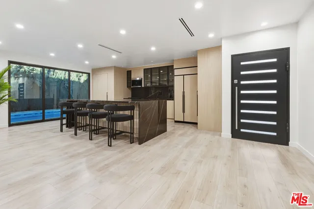 a view of a livingroom with furniture and stairs