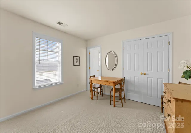 a view of a livingroom with furniture and windows