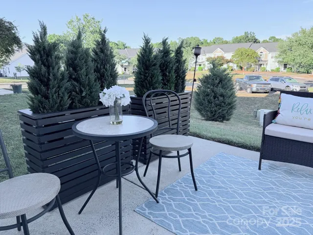 a view of a chairs and table in the patio