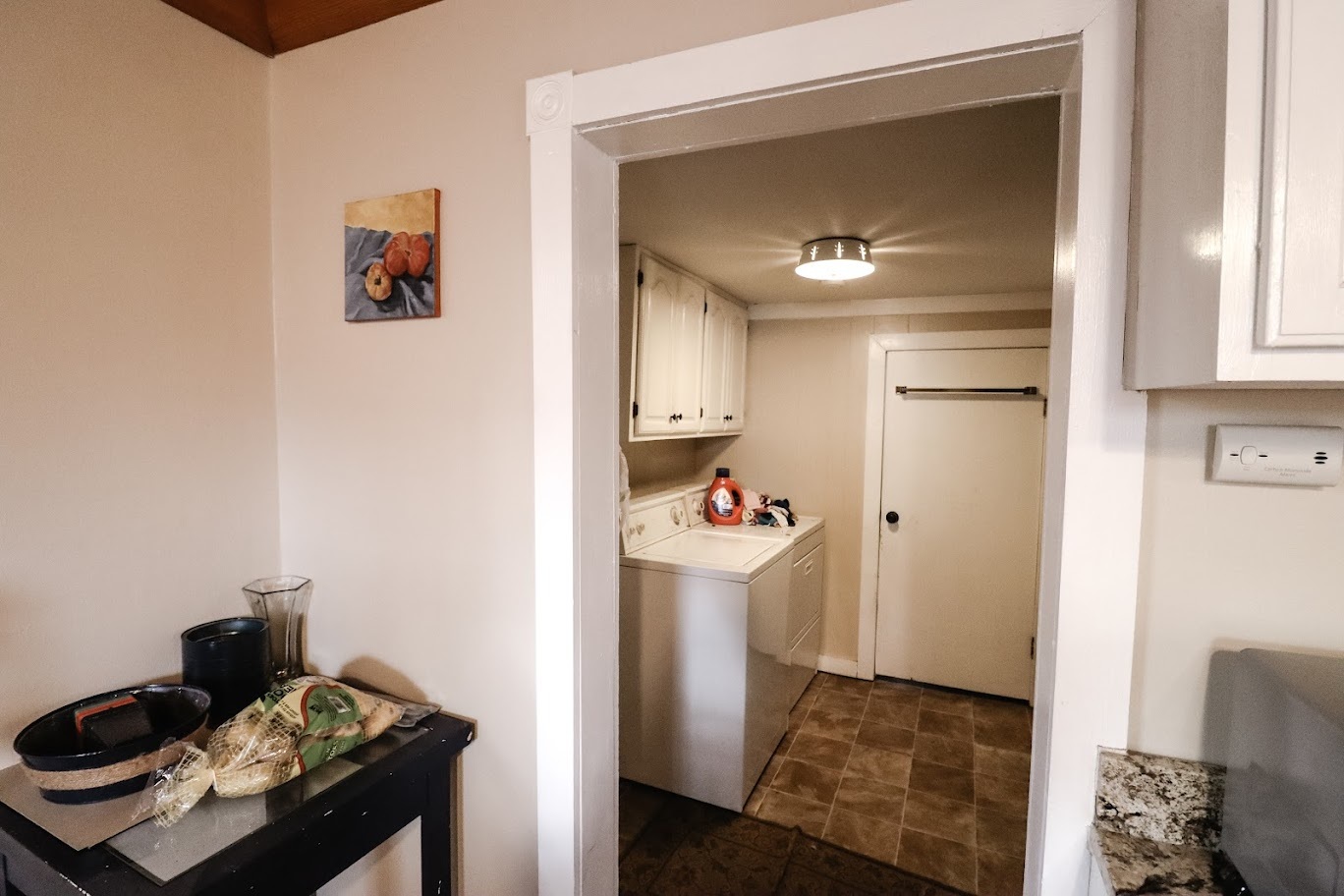 35 Monroe Avenue Charleston, IL 61920 - Photo 16 of 23 a room that has a bed and a table in it