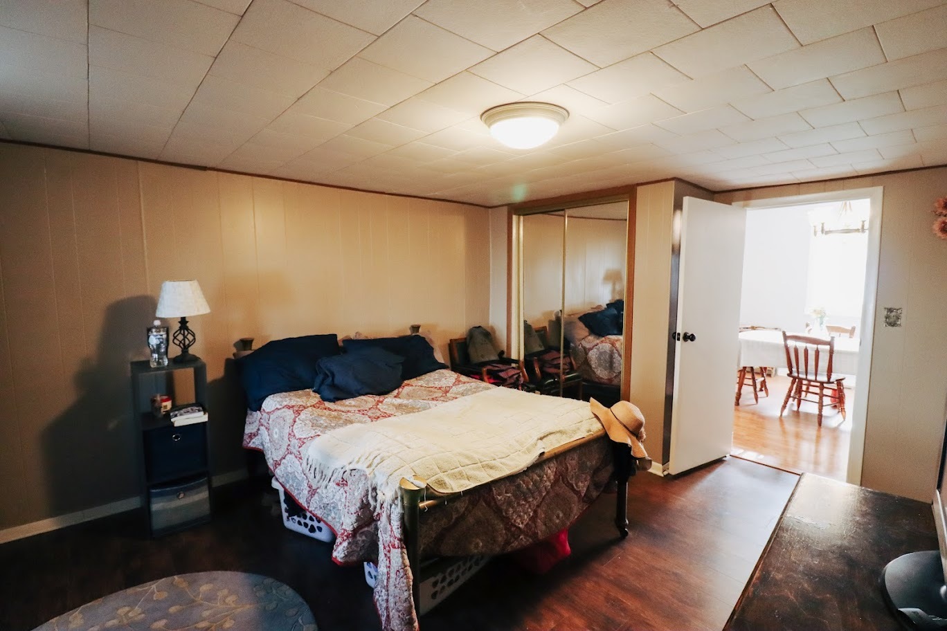 35 Monroe Avenue Charleston, IL 61920 - Photo 17 of 23 a bed room with a bed and a couch