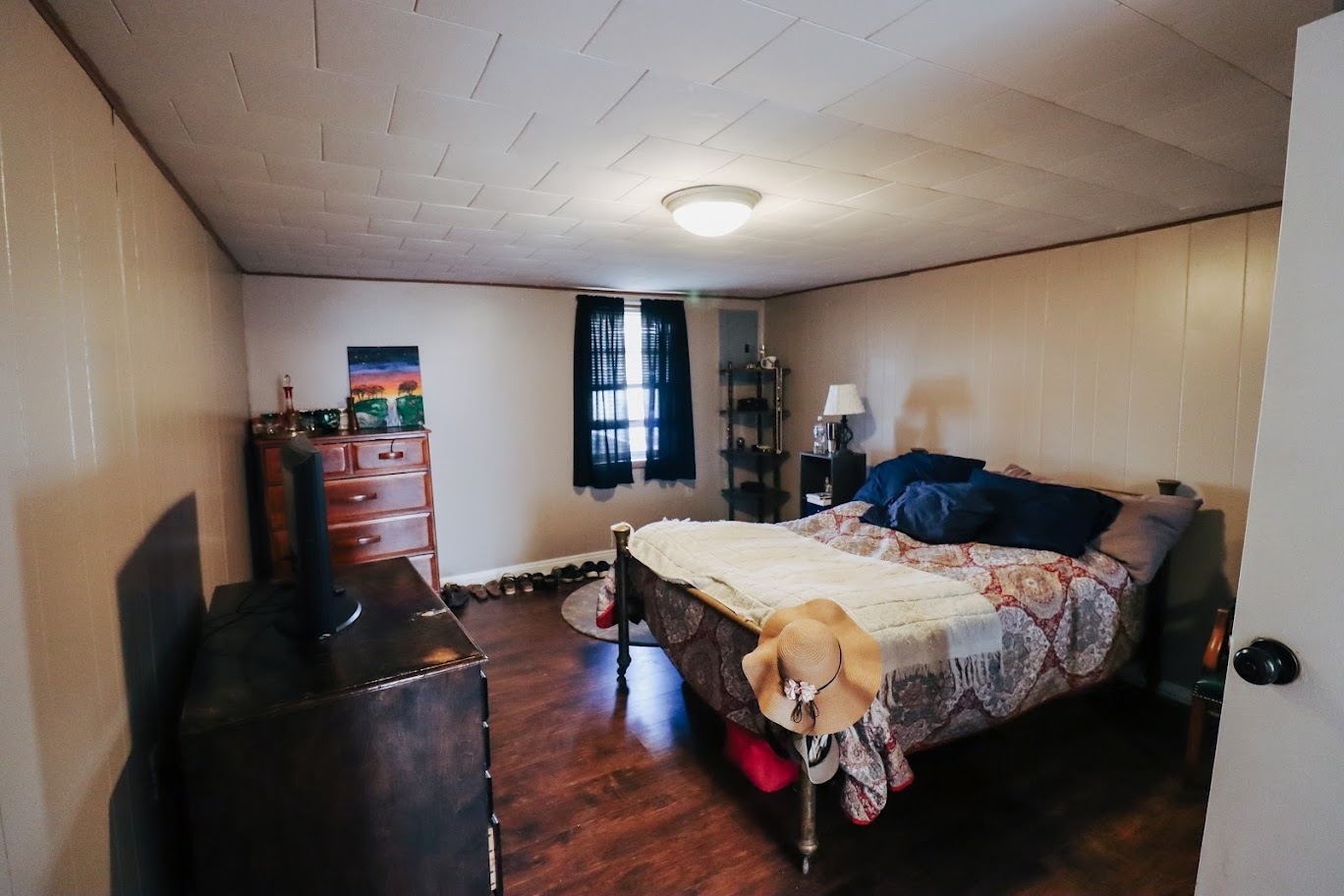 35 Monroe Avenue Charleston, IL 61920 - Photo 18 of 23 a bedroom with a bed a dresser and a large mirror