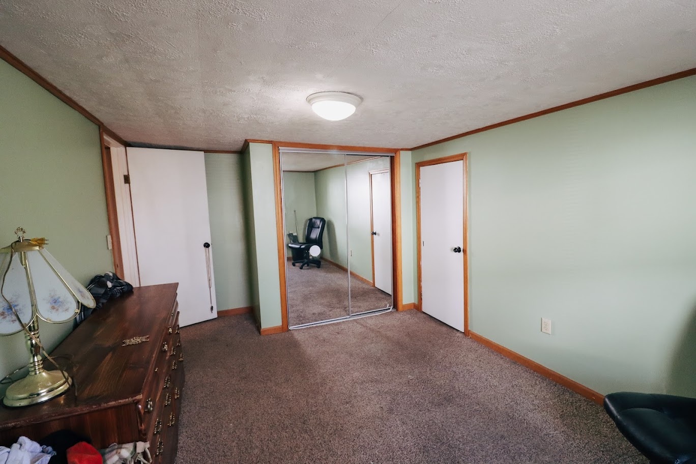 35 Monroe Avenue Charleston, IL 61920 - Photo 19 of 23 a view of a livingroom with furniture and storage