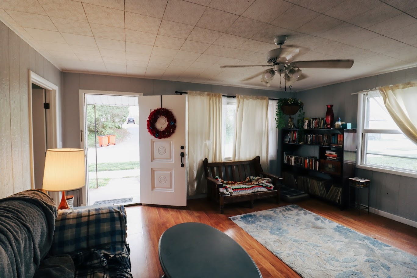 35 Monroe Avenue Charleston, IL 61920 - Photo 4 of 23 a living room with furniture a window and a chandelier