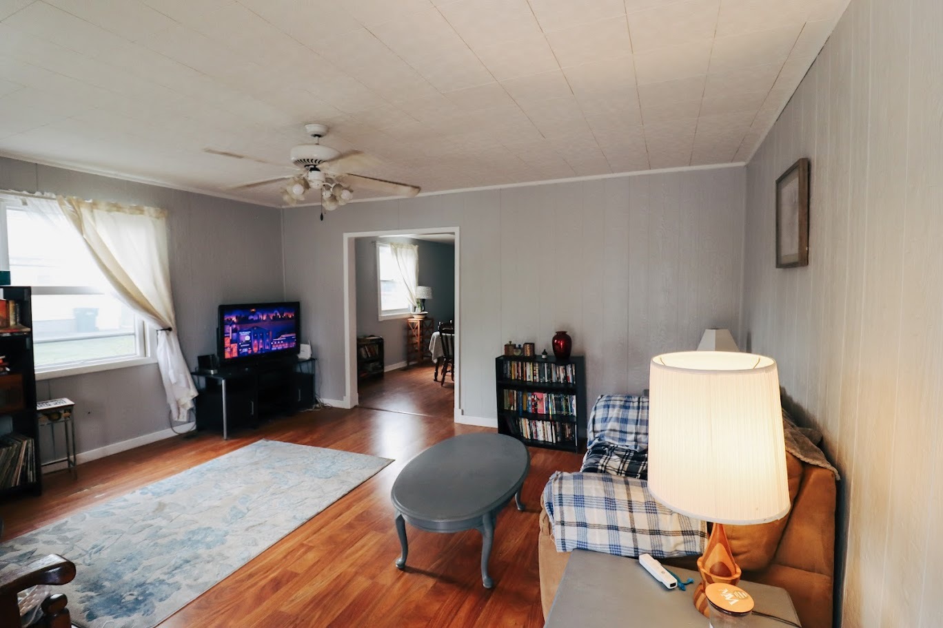 35 Monroe Avenue Charleston, IL 61920 - Photo 5 of 23 a living room with furniture and a flat screen tv
