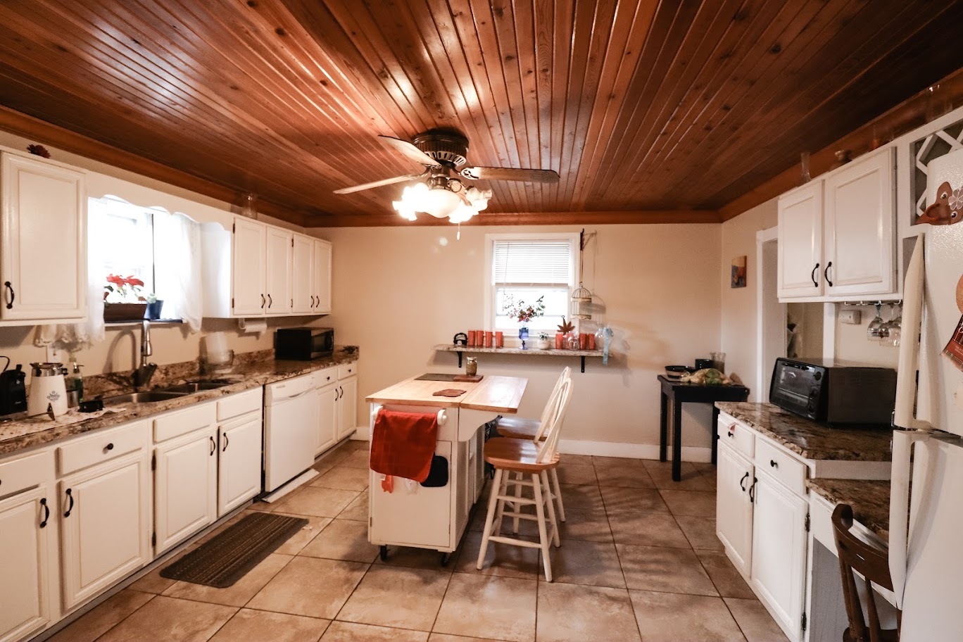 35 Monroe Avenue Charleston, IL 61920 - Photo 10 of 23 a large kitchen with lots of counter space and window