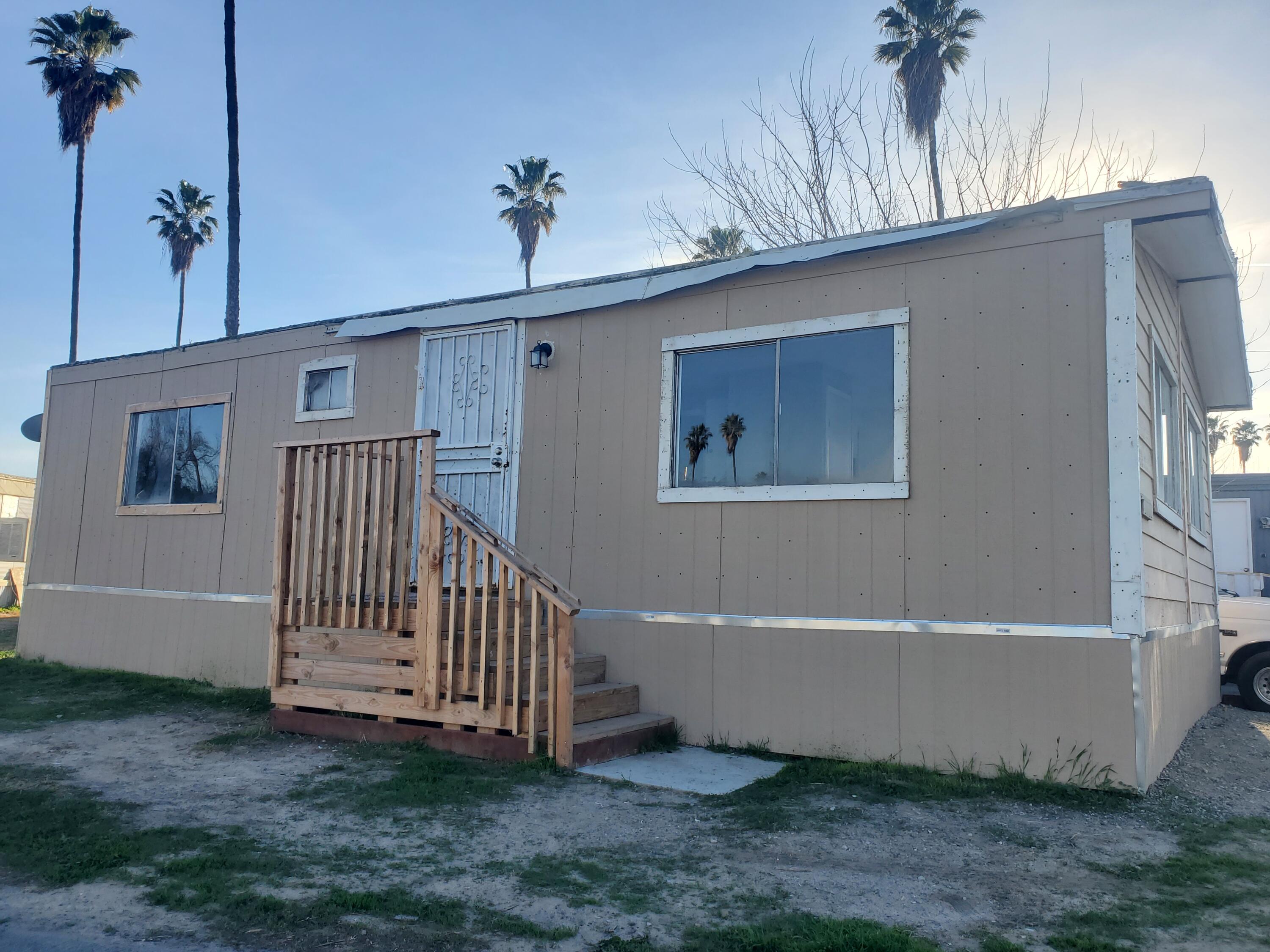 9630 Highway 41 Lemoore, CA 93245 - Photo 2 of 10 a view of a house with a yard