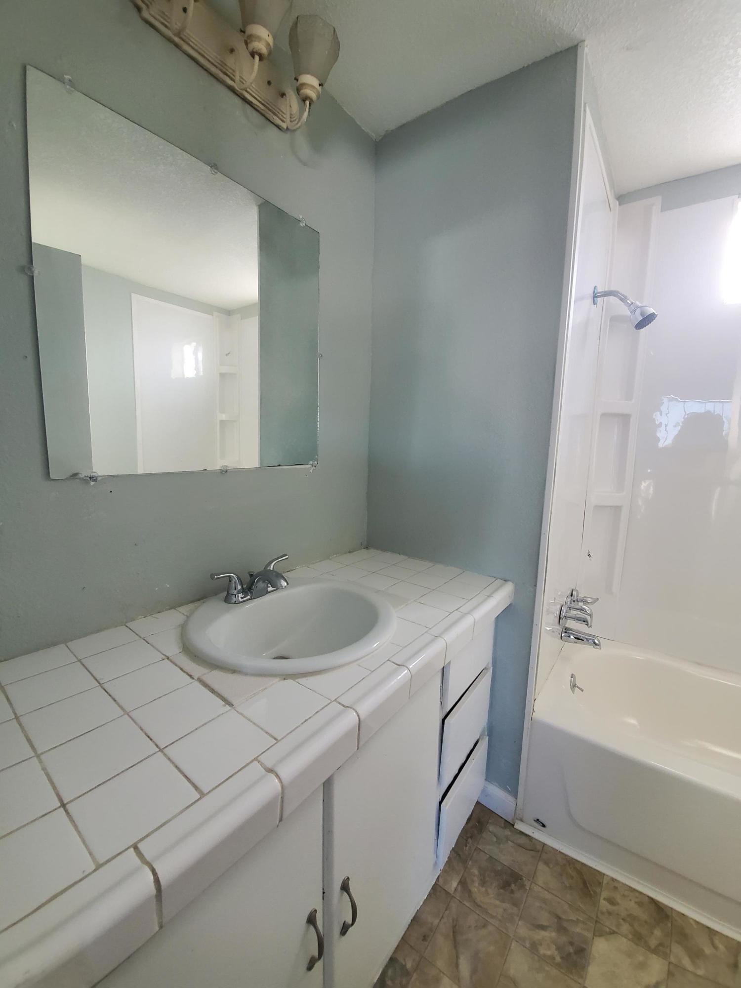 9630 Highway 41 Lemoore, CA 93245 - Photo 6 of 10 a bathroom with a sink and a mirror