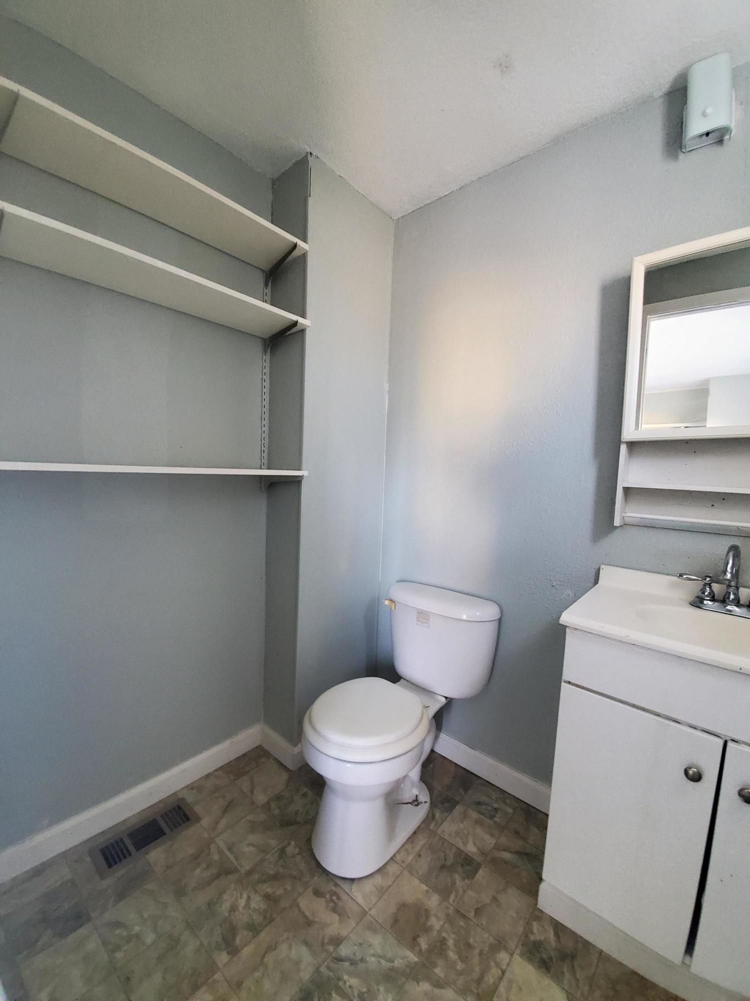 9630 Highway 41 Lemoore, CA 93245 - Photo 9 of 10 a bathroom with a toilet and a sink