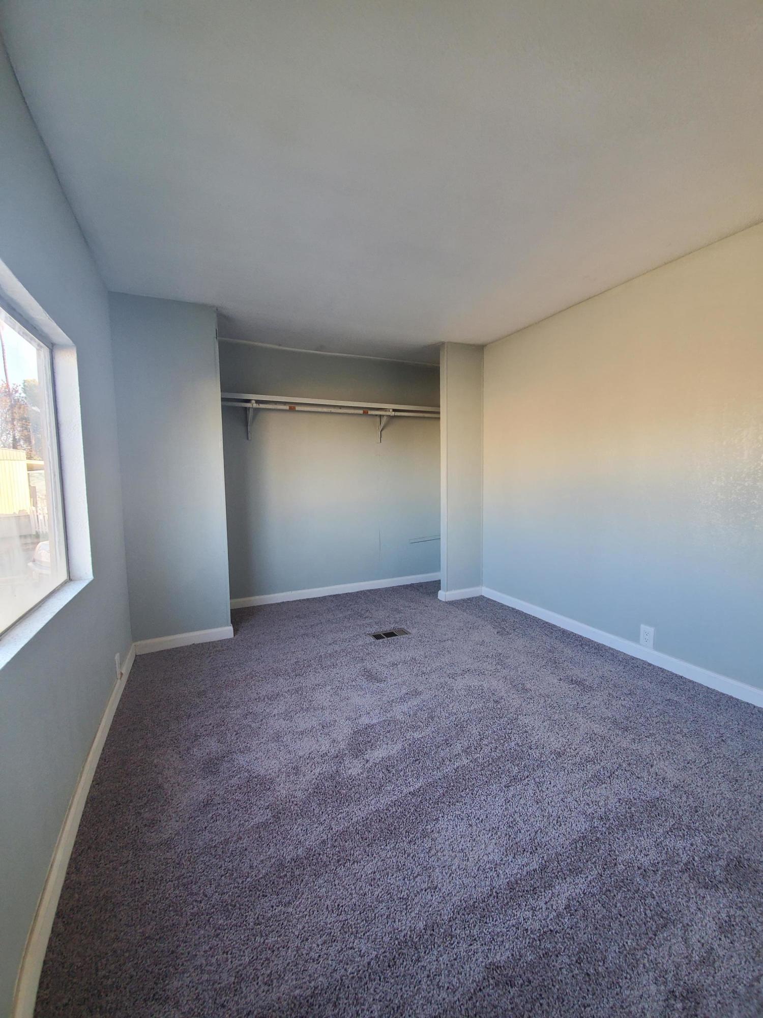 9630 Highway 41 Lemoore, CA 93245 - Photo 10 of 10 an empty room with windows and closet
