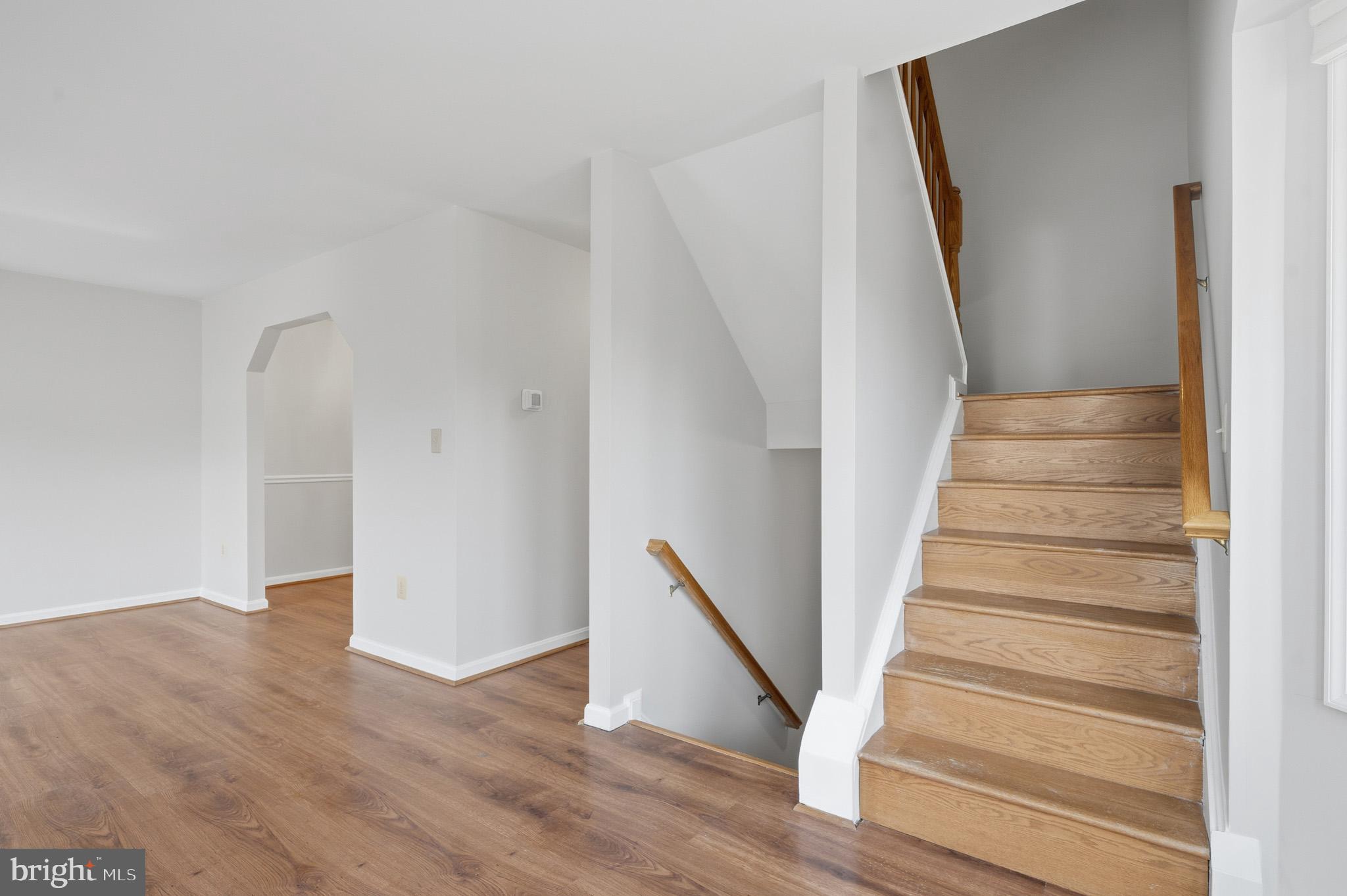 9146 Hardesty Drive Clinton, MD 20735 - Photo 13 of 47 a view of staircase with wooden floor and white walls