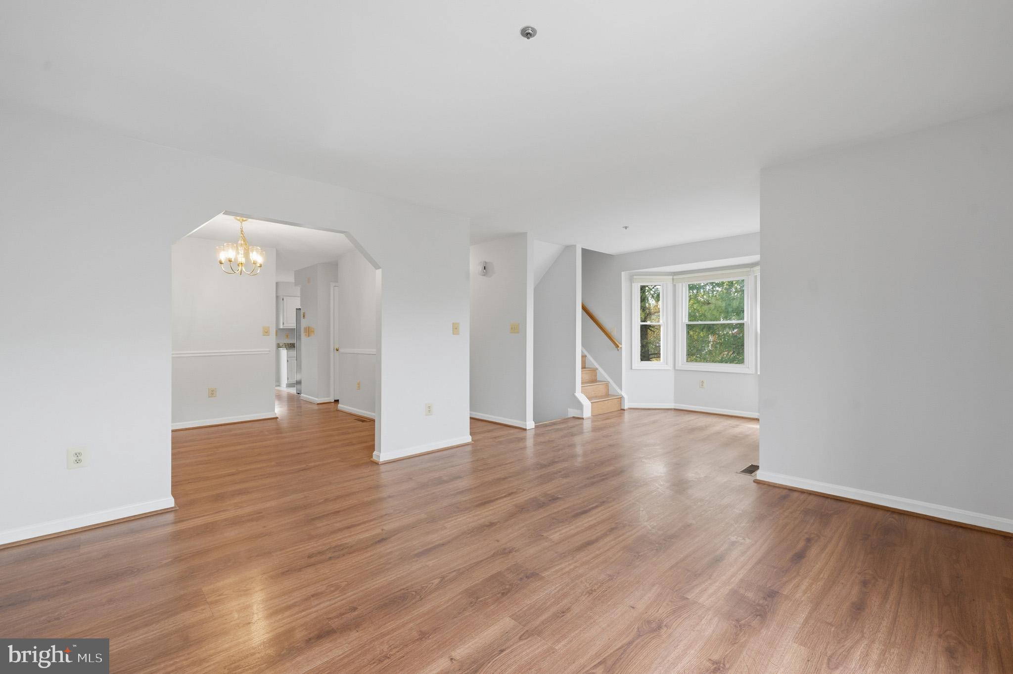 9146 Hardesty Drive Clinton, MD 20735 - Photo 15 of 47 a view of a big room with wooden floor and windows