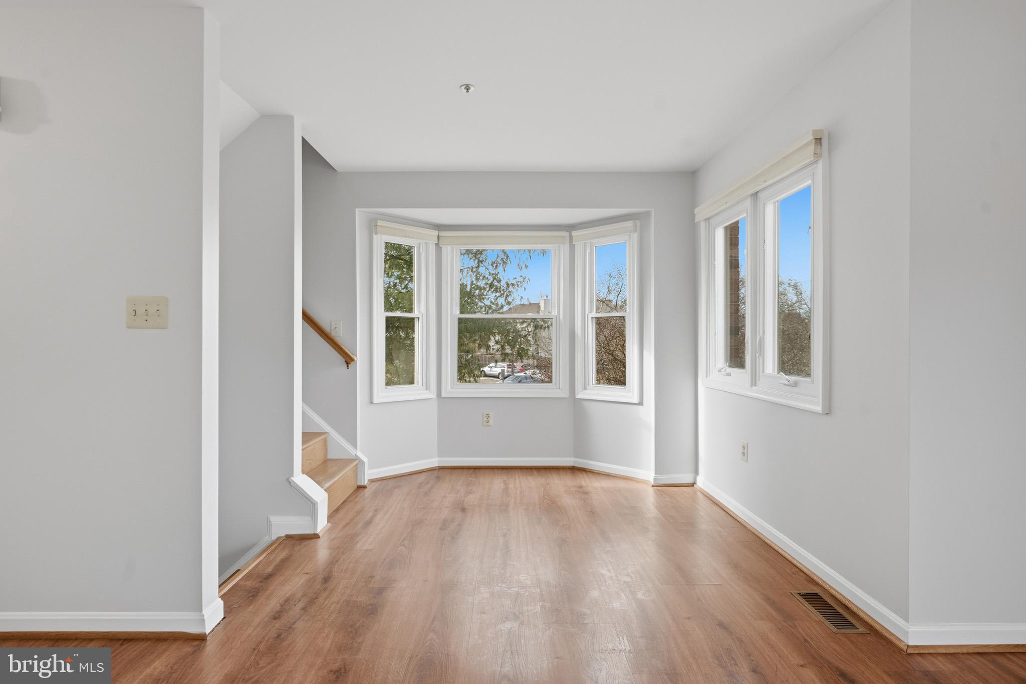 9146 Hardesty Drive Clinton, MD 20735 - Photo 16 of 47 a view of an empty room with wooden floor and a window