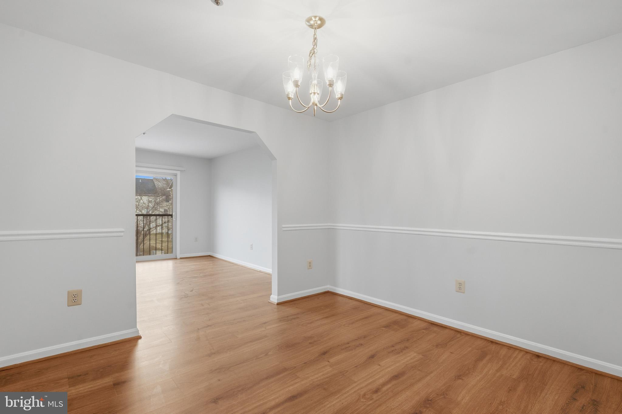 9146 Hardesty Drive Clinton, MD 20735 - Photo 18 of 47 wooden floor in an empty room with a window