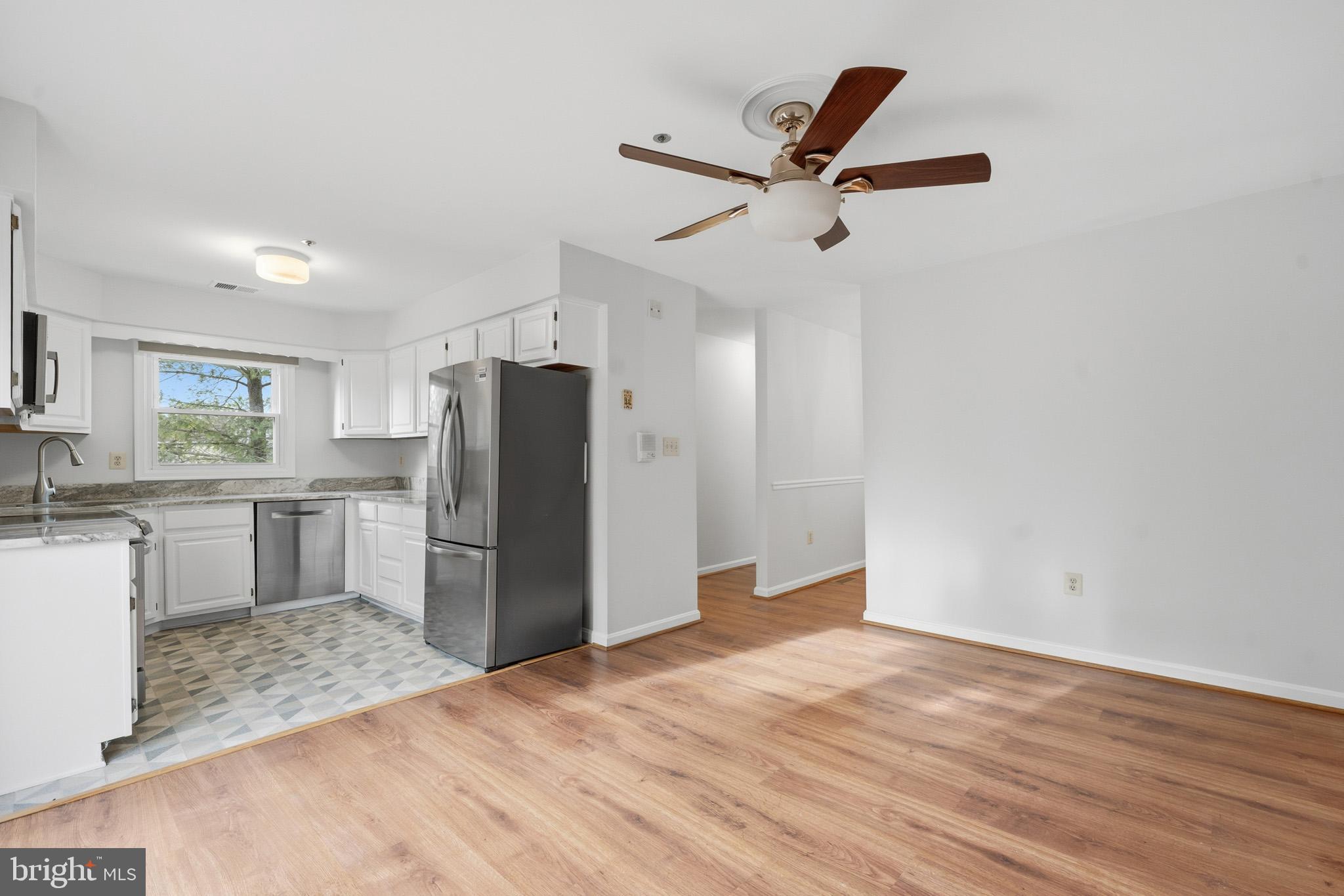 9146 Hardesty Drive Clinton, MD 20735 - Photo 20 of 47 a kitchen with a refrigerator and a sink